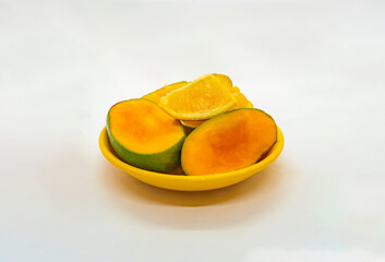 Mixed Fruits Isolated White Background Tropical Mangoes and Oranges Tangerine Cut Slices in Basket