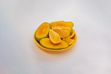Mixed Fruits Isolated White Background Tropical Mangoes and Oranges Tangerine Cut Slices in Basket