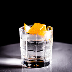 White negroni cocktail on black background