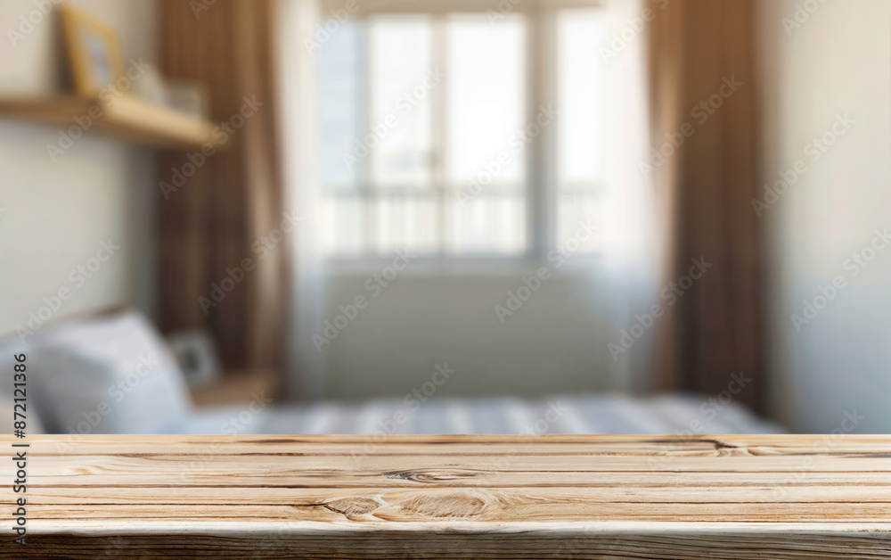 Poster empty wooden table displaying blurred bedroom background with natural light for product placement