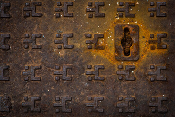 Dettaglio di un tombino arrugginito