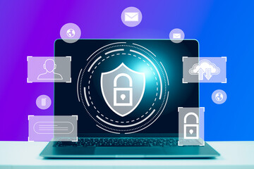 A laptop computer is on a table with a padlock on it. Computer protection concept. Password. Hacker.