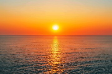 Obraz premium Ethereal Horizon: Sunset Over the Sea Painting the Sky in Shades of Orange