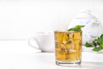 Herbal flower Deaf nettle ice tea, infused aromatic cold drink with dead nettle wildflower and ice cubes, copy space