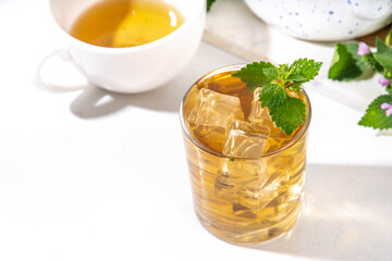 Herbal flower Deaf nettle ice tea, infused aromatic cold drink with dead nettle wildflower and ice cubes, copy space