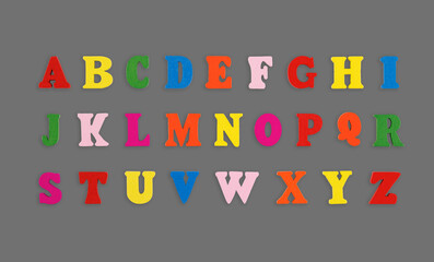 wooden letters of the English alphabet multi-colored on a grey background
