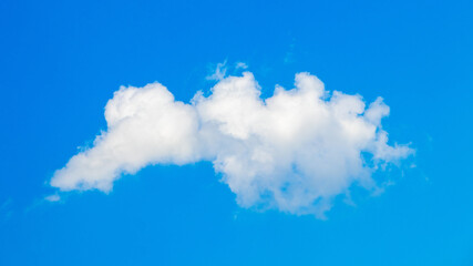 A small fluffy cloud in the blue sky