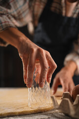 Chef's Hands Cutting Dough Circles with Glass for Dumplings