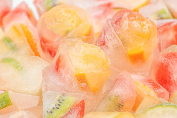 fresh berries in ice cubes fruit ice background