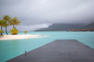 Wooden dock over turquoise water, Bora Bora lagoon, French Polynesia