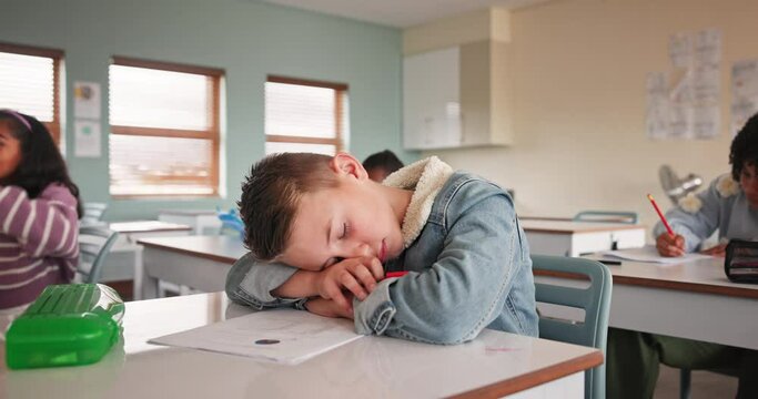 Boy, tired and classroom for lesson and student, bored and sleep in elementary school. Fatigue, knowledge and project for overworked young person, education and exchange learner with burnout in exam