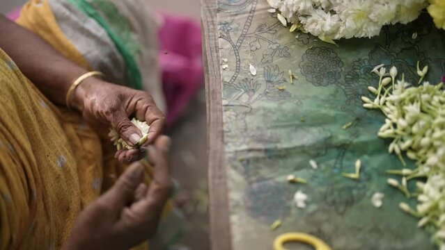 Indian flower seller at Hindu temple