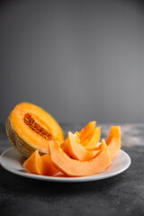 Melon Charentais sweet fruit fresh appetizer meal food snack on the table copy space food background rustic top view keto or paleo diet vegetarian vegan food