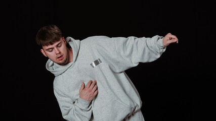 Dynamic hip-hop dancer in action on a black background