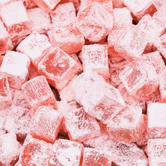 Close Up of Pink Turkish Delight Candy Coated in Powdered Sugar