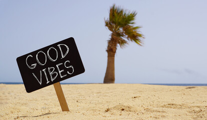 Good vibes only are shown using the text on the sea beach