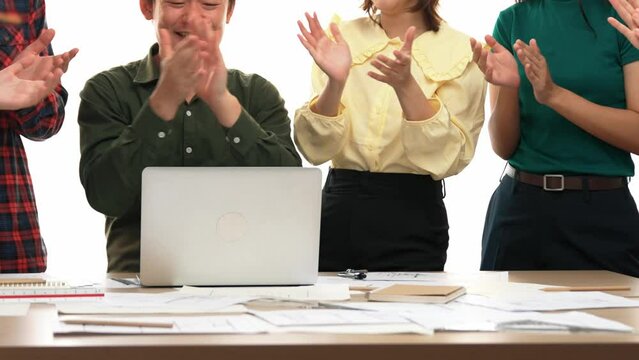 Architect and safety engineer celebrate success design building blueprint project on laptop with architectural document and measurement tool scatter around at modern office. Closeup. Delineation.
