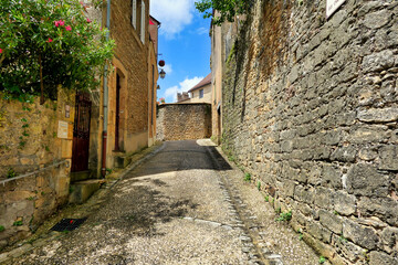 Medieval street in the 11th century fortified village of Belves in the Dordogne, France
