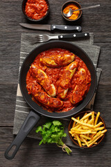 German Currywurst, pork sausages in a curry sauce