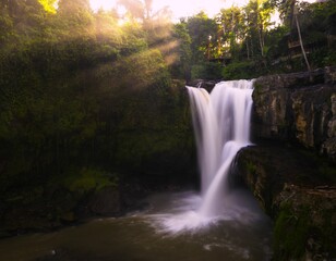 Fototapeta premium Tegenungan Waterfall during sunrise, Bali, Indonesia