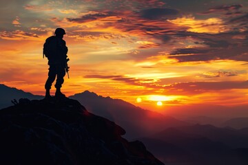 Heroic Sunset: WW2 Soldier Silhouette on Mountain Peak at Sunset - An Iconic Image of Courage and Heroism Against a Dramatic Sky.