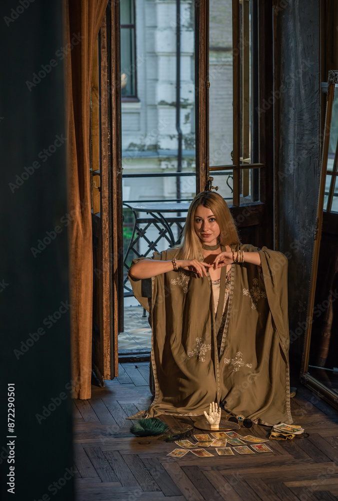 Wall mural woman with a tarot or oracle cards . occultism concept, esoteric knowledge and hobby