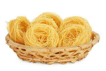 Italian pasta tagliatelle nest in wicker basket isolated on white background with full depth of field.