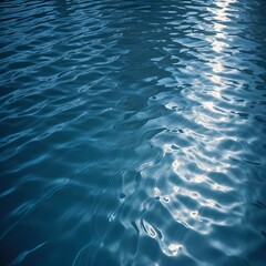 Obraz premium Rippling blue water surface with light reflections