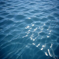 Rippling blue water surface with light reflections
