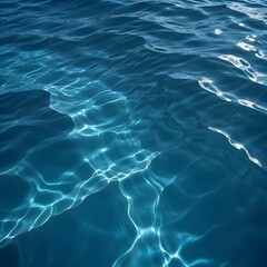 Fototapeta premium Rippling blue water surface with light reflections