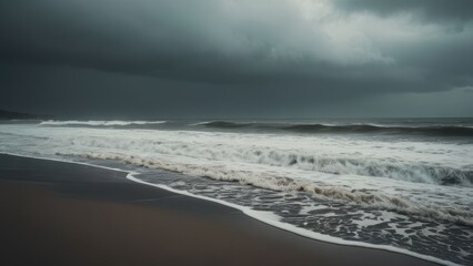 Obraz premium A dramatic wide-angle shot captures powerful waves crashing against the shore under a dark, stormy winter sky.