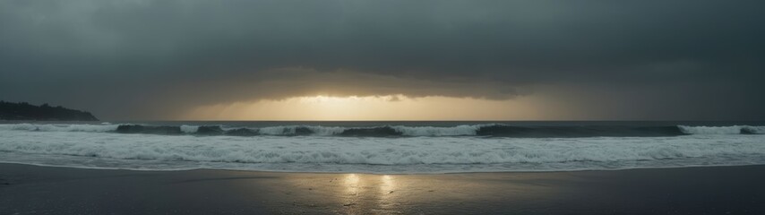 Fototapeta premium A dramatic wide-angle shot captures powerful waves crashing against the shore under a dark, stormy winter sky.
