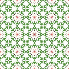 Seamless floral pattern with green and orange geometric shapes on a white background.