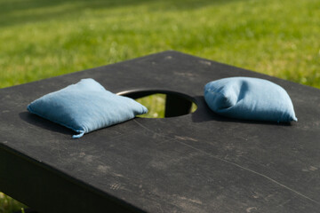 Cornhole bags on a cornhole board close up shot