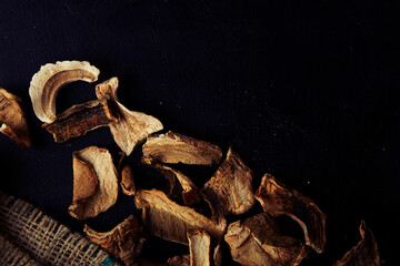 Dried porcini mushrooms, antioxidant-rich food. Natural wild food - low ecological footprint, sustainable product close up.