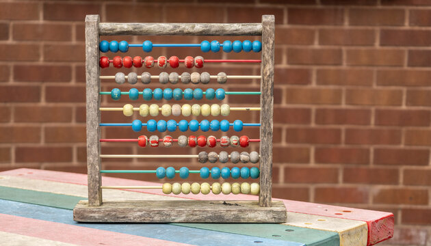 Traditional Vintage style Abacus On brick Background, vintage school days concept