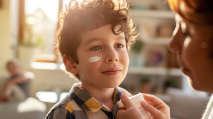 Parent applying anti-itch cream to child's face, caring for allergic reaction, tender family moment