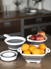 Fruits on the table. Oranges and apples on the table