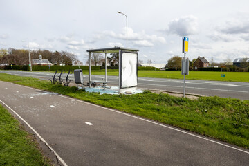 demolished bus stop in besides a road