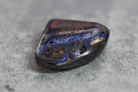 Very-high quality focus bracketing of a colorful boulder opal gem from Koroit Australia