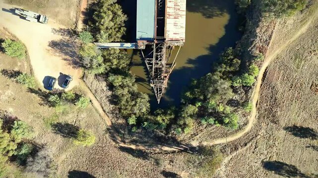Aerial of the eldorado gold dredge on a small lake next to trees