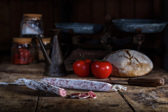 Vintage rustic kitchen scene with assorted cured meats