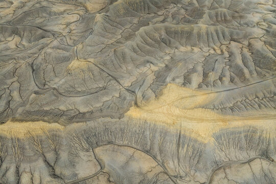 Aerial view of intricate badland textures and earthy tones