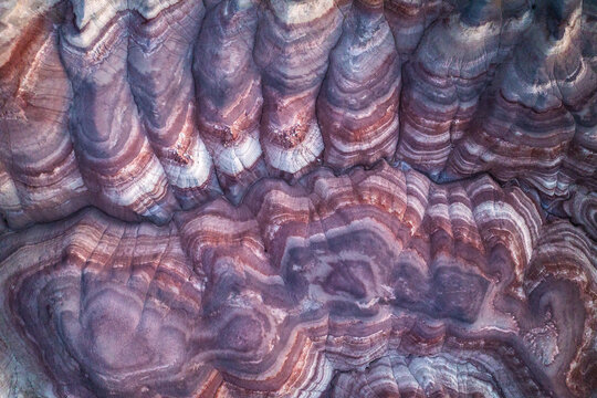Aerial view of colorful bentonite hills in stratified patterns
