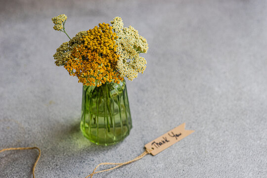Fresh meadow wildflowers in a rustic table setting