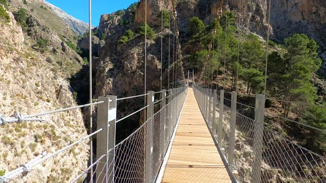 Hiking trail to Colgante bridge (Puente Colgante El Saltillo) over Almanchares river, Sierra Tejeda, Andalusia, Spain