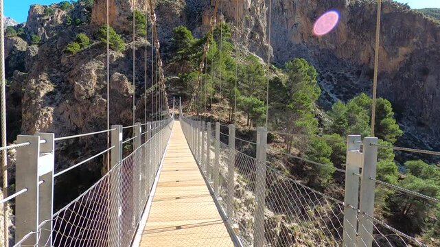 Hiking trail to Colgante bridge (Puente Colgante El Saltillo) over Almanchares river, Sierra Tejeda, Andalusia, Spain