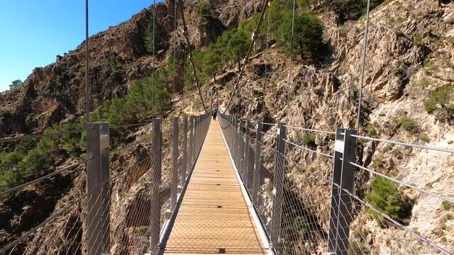 Hiking trail to Colgante bridge (Puente Colgante El Saltillo) over Almanchares river, Sierra Tejeda, Andalusia, Spain