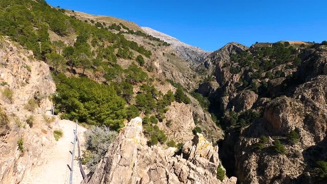 Hiking trail to Colgante bridge (Puente Colgante El Saltillo) over Almanchares river, Sierra Tejeda, Andalusia, Spain