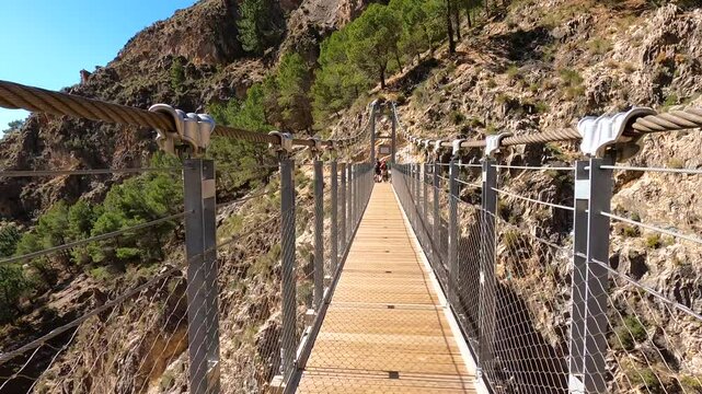 Hiking trail to Colgante bridge (Puente Colgante El Saltillo) over Almanchares river, Sierra Tejeda, Andalusia, Spain